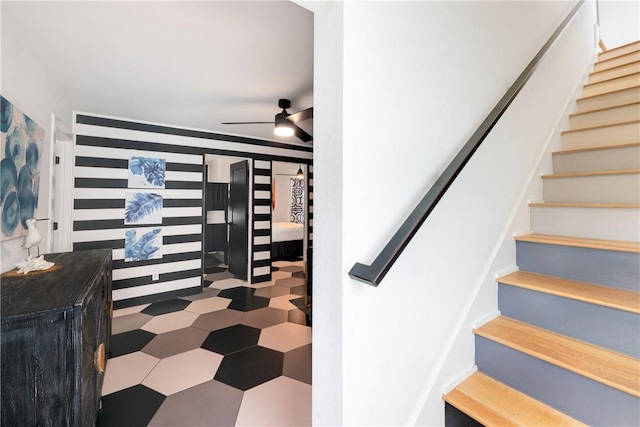 500 Royal Palm Ln, Port Aransas, TX 78373 - stairway with ceiling fan and tile patterned floors