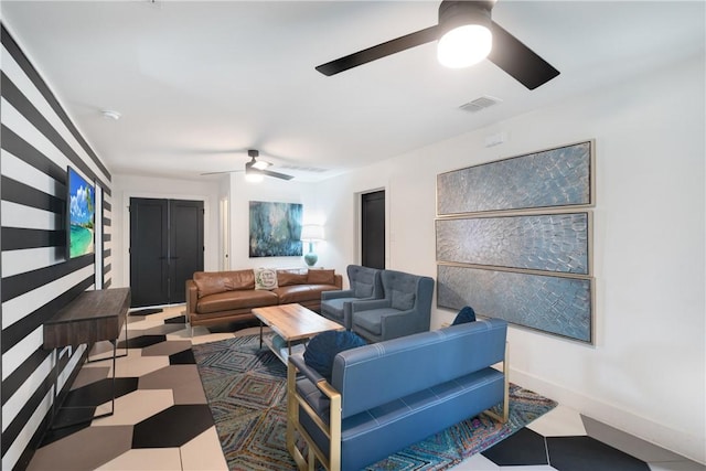 500 Royal Palm Ln, Port Aransas, TX 78373 - living room featuring a ceiling fan and baseboards