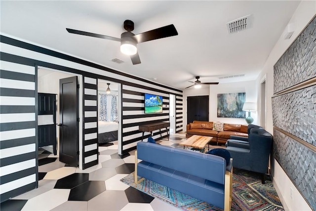 500 Royal Palm Ln, Port Aransas, TX 78373 - living room featuring ceiling fan and tile patterned floors