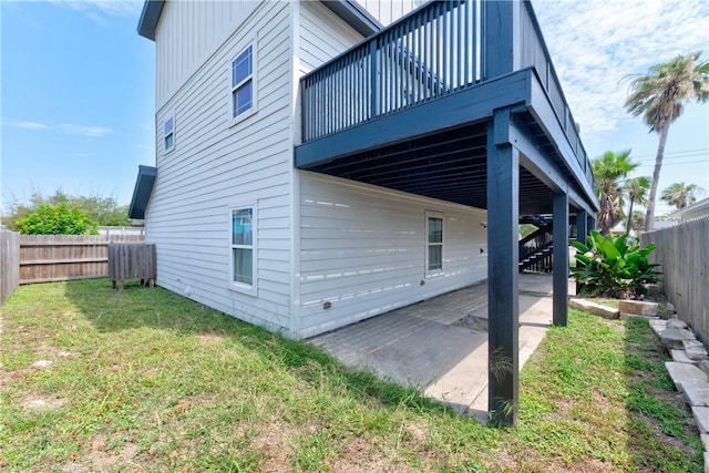 500 Royal Palm Ln, Port Aransas, TX 78373 - view of home's exterior with a patio area and a wooden deck