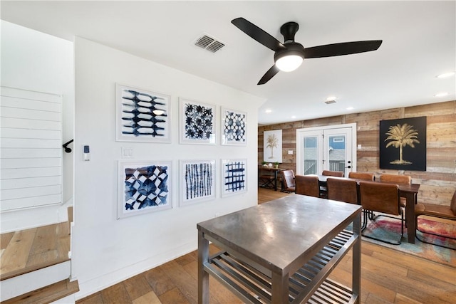 500 Royal Palm Ln, Port Aransas, TX 78373 - dining room with ceiling fan, hardwood / wood-style floors, wood walls, and recessed lighting