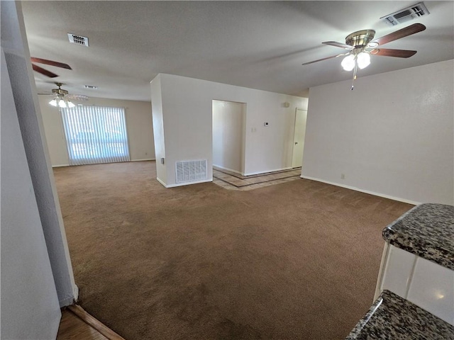 unfurnished living room with carpet and visible vents