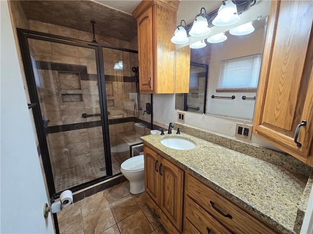 full bathroom with toilet, a shower stall, and vanity