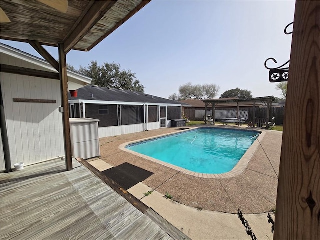 view of pool featuring a patio, a fenced backyard, a sunroom, a fenced in pool, and a pergola