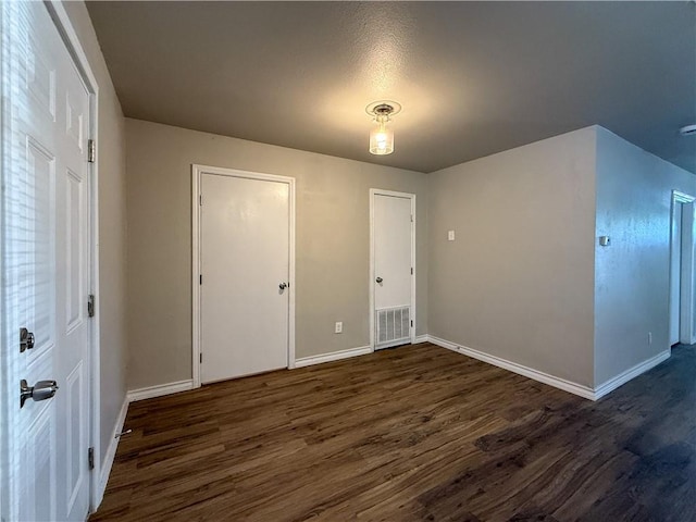 1021 Dona Dr, Corpus Christi, TX 78407 - unfurnished bedroom with dark wood-style floors and baseboards