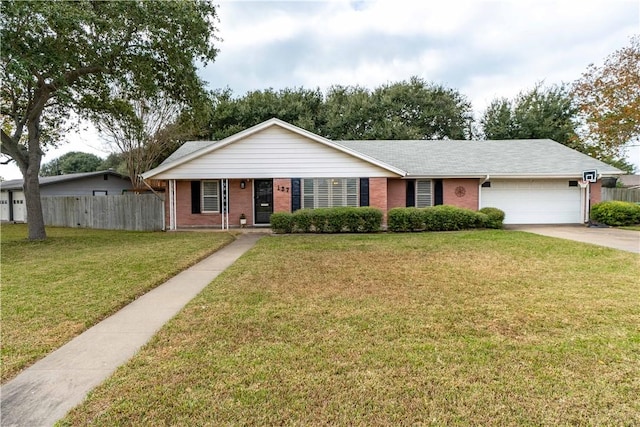 single story home with a garage and a front yard