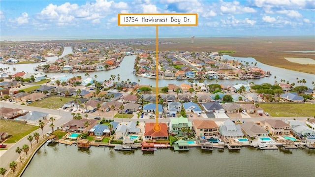 bird's eye view featuring a residential view and a water view