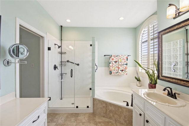 full bathroom with vanity, tile patterned floors, recessed lighting, a bath, and a stall shower