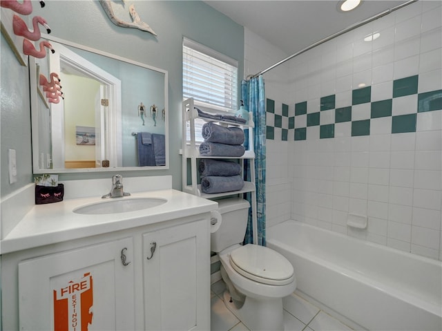 full bathroom featuring tile patterned flooring, vanity, toilet, and shower / tub combo with curtain