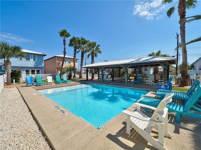 view of swimming pool with a patio and a gazebo