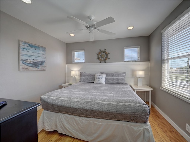 bedroom with light wood-type flooring and ceiling fan