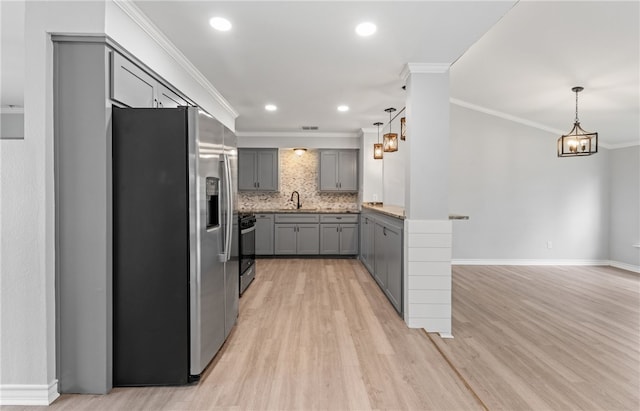 1333 Prince Dr, Corpus Christi, TX 78412 - kitchen featuring stainless steel refrigerator with ice dispenser, gray cabinetry, a sink, gas stove, and crown molding