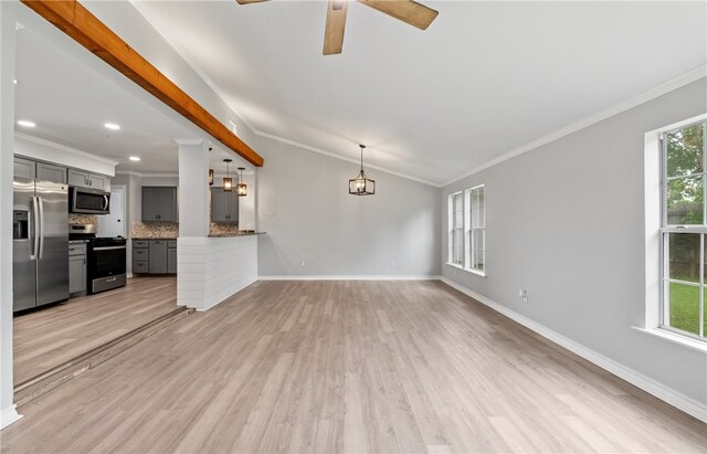 1333 Prince Dr, Corpus Christi, TX 78412 - unfurnished living room with light wood finished floors, baseboards, crown molding, ceiling fan, and lofted ceiling