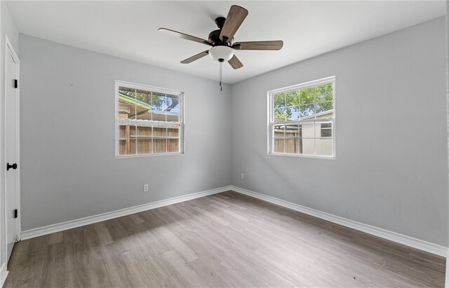 1333 Prince Dr, Corpus Christi, TX 78412 - empty room featuring wood finished floors, baseboards, and ceiling fan