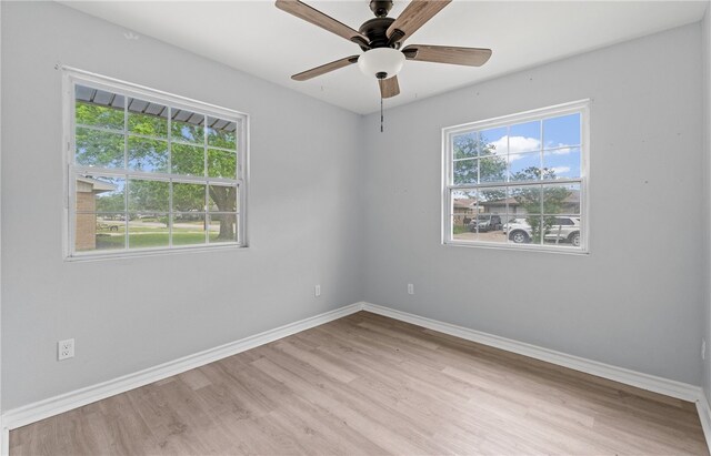 1333 Prince Dr, Corpus Christi, TX 78412 - spare room with wood finished floors, baseboards, and ceiling fan