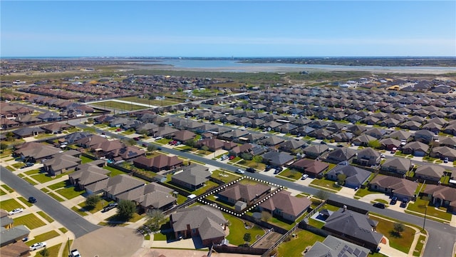 birds eye view of property featuring a residential view and a water view