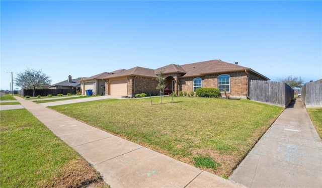 view of front of home with brick siding, a front lawn, fence, driveway, and an attached garage