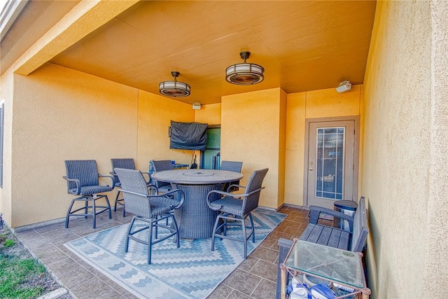 view of patio featuring outdoor dining area