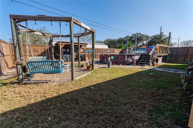 view of yard with a fenced in pool and a fenced backyard