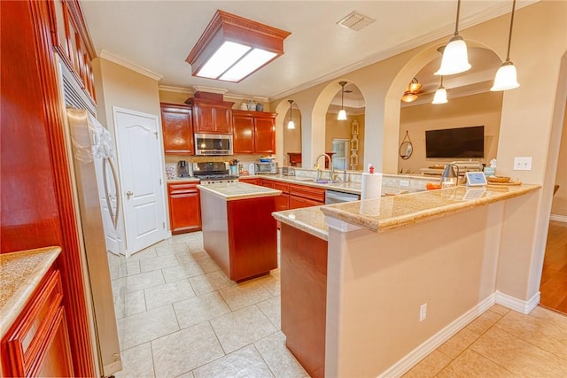 kitchen featuring visible vents, a peninsula, arched walkways, appliances with stainless steel finishes, and reddish brown cabinets