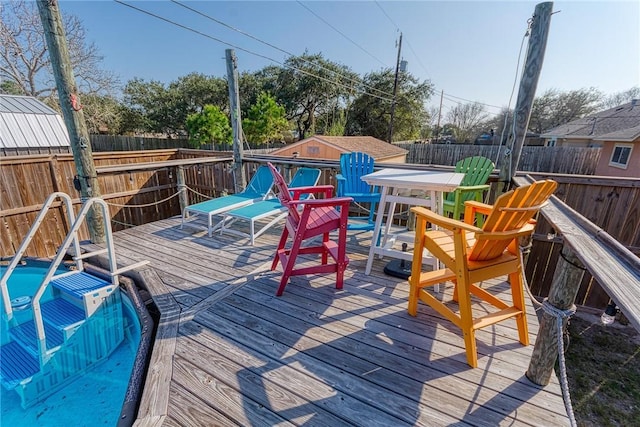 deck featuring a fenced backyard