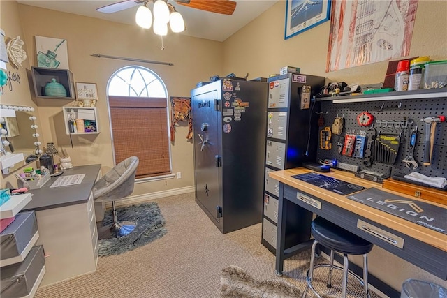 office space with a ceiling fan and carpet