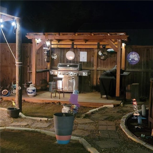 view of patio / terrace featuring area for grilling and fence