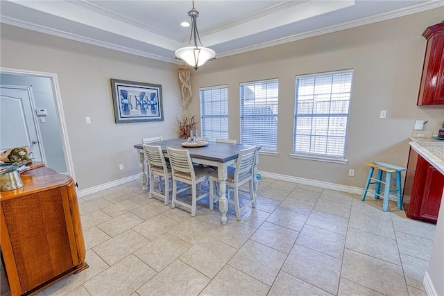 dining space featuring a tray ceiling, light tile patterned flooring, crown molding, and baseboards