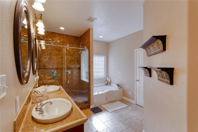 bathroom with visible vents, double vanity, a stall shower, a bath, and a sink