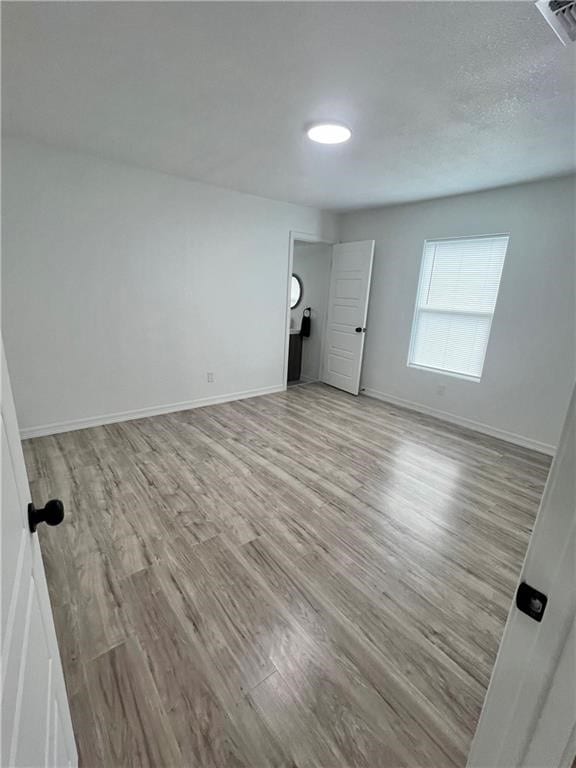 unfurnished bedroom featuring light hardwood / wood-style flooring