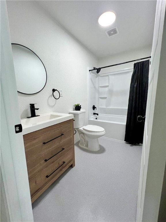 full bathroom featuring shower / bath combo, vanity, and toilet