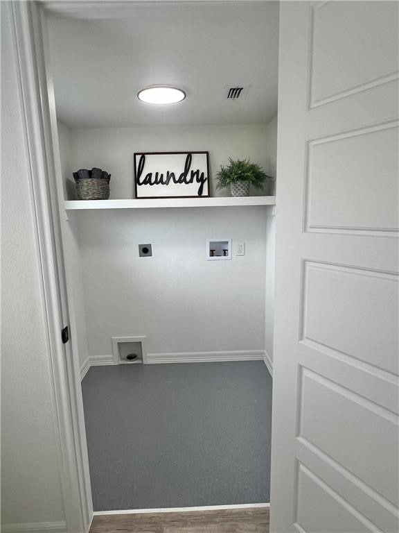 clothes washing area featuring washer hookup, carpet floors, and hookup for an electric dryer