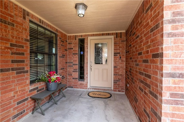 14426 Pentridge Dr, Corpus Christi, TX 78410 - doorway to property featuring brick siding and covered porch