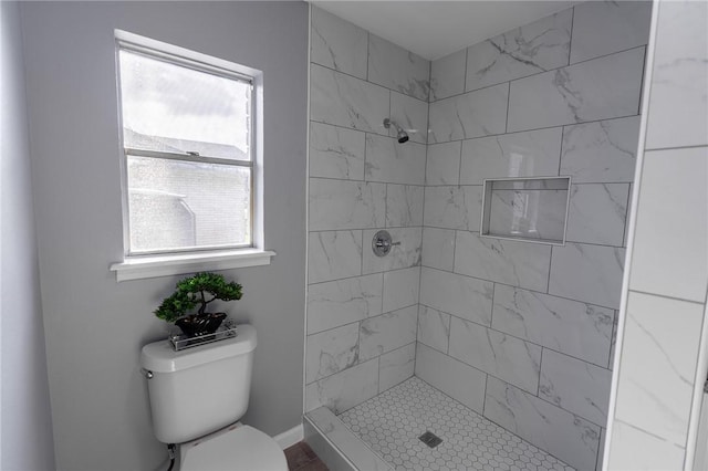 3809 Capri Dr, Corpus Christi, TX 78415 - bathroom featuring a tile shower and toilet