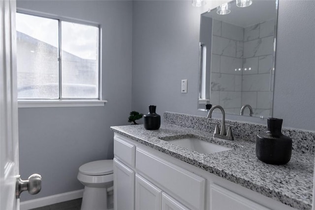 3809 Capri Dr, Corpus Christi, TX 78415 - bathroom with vanity, toilet, and a shower