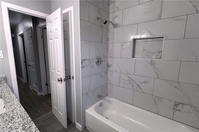 3809 Capri Dr, Corpus Christi, TX 78415 - bathroom with shower / bath combination, wood finished floors, and vanity