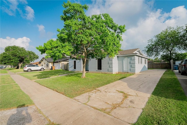 3809 Capri Dr, Corpus Christi, TX 78415 - view of front facade with concrete driveway and brick siding