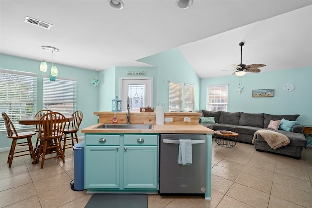 kitchen with visible vents, hanging light fixtures, open floor plan, a sink, and dishwasher