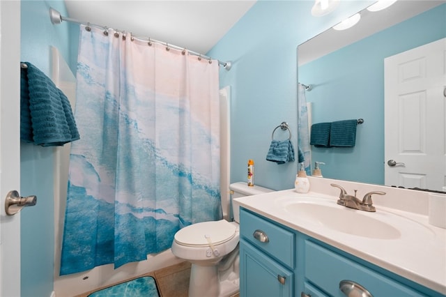 bathroom with toilet, tile patterned flooring, and vanity