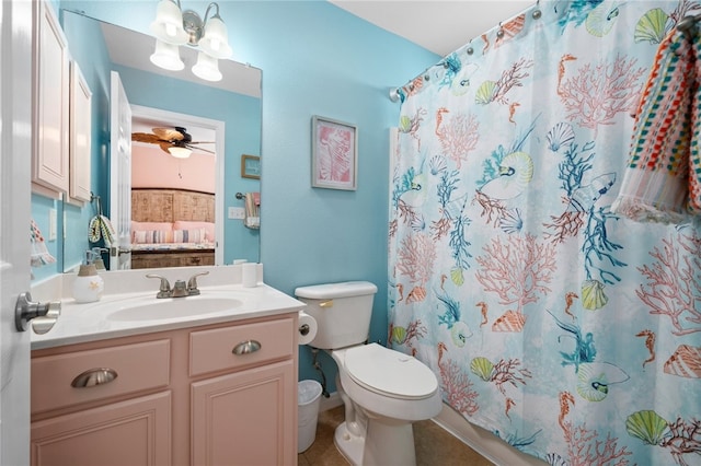 ensuite bathroom featuring curtained shower, toilet, vanity, ensuite bath, and ceiling fan with notable chandelier