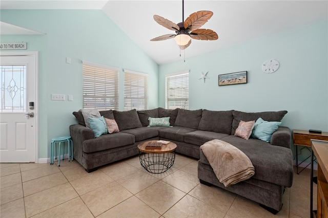 living area featuring light tile patterned floors, vaulted ceiling, and a ceiling fan