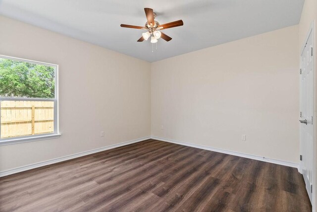 2201 Morris St, Corpus Christi, TX 78405 - spare room featuring dark wood finished floors and a ceiling fan