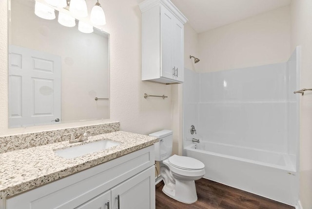 2201 Morris St, Corpus Christi, TX 78405 - bathroom featuring wood finished floors, vanity, and shower / tub combination