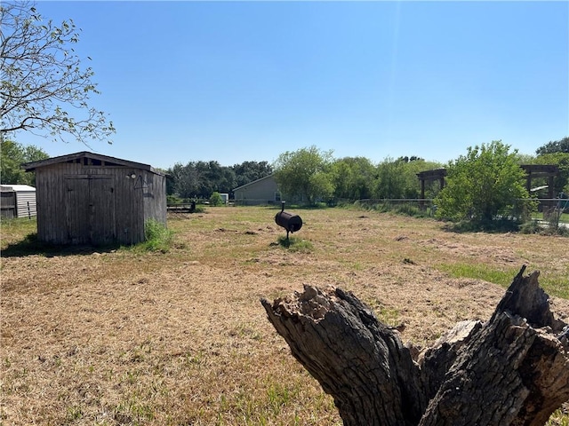 5417 Bonner Dr, Corpus Christi, TX 78411 - view of yard featuring a storage unit
