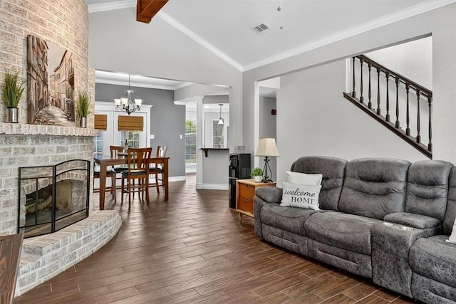 7609 Stony Brook Dr, Corpus Christi, TX 78413 - living room featuring dark wood finished floors, a chandelier, and a brick fireplace