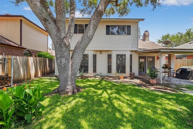 7609 Stony Brook Dr, Corpus Christi, TX 78413 - back of property with a patio and a chimney