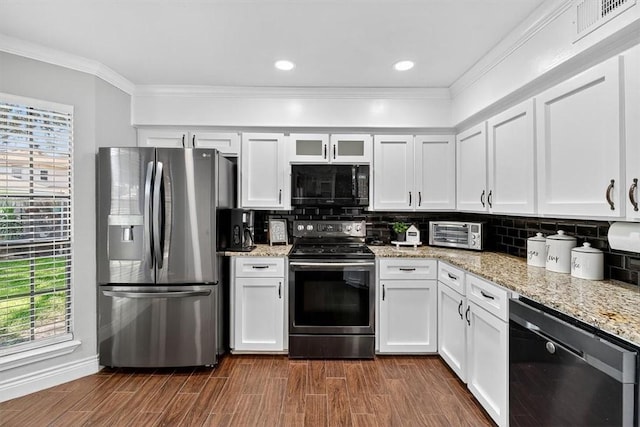7609 Stony Brook Dr, Corpus Christi, TX 78413 - kitchen featuring appliances with stainless steel finishes, white cabinetry, tasteful backsplash, light stone counters, and ornamental molding