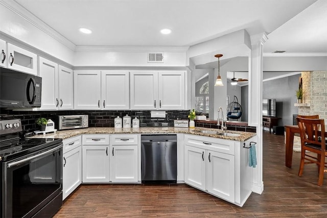 7609 Stony Brook Dr, Corpus Christi, TX 78413 - kitchen with dishwasher, electric range oven, black microwave, crown molding, and backsplash