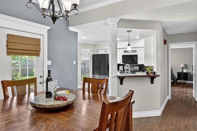 7609 Stony Brook Dr, Corpus Christi, TX 78413 - dining area featuring healthy amount of natural light, ornamental molding, dark wood finished floors, a chandelier, and recessed lighting