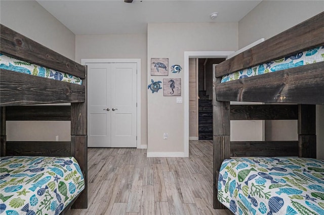 bedroom featuring a closet and light hardwood / wood-style flooring